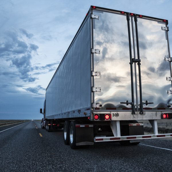 rear-view-of-the-trailer-on-a-class-8-commercial-truck-on-the-highway-.jpg